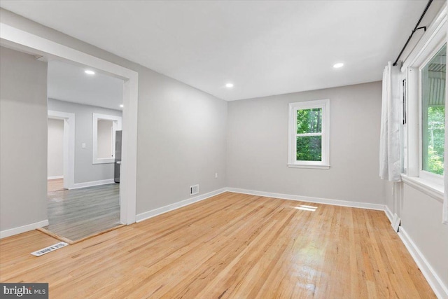 spare room with light hardwood / wood-style floors