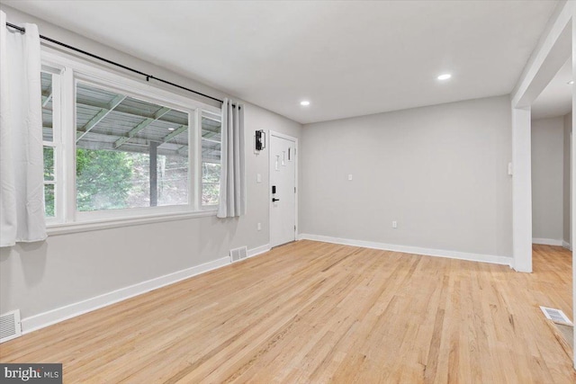 empty room with light wood-type flooring