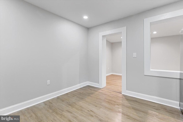 unfurnished room featuring light hardwood / wood-style flooring