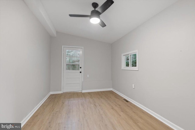 unfurnished room with ceiling fan, light hardwood / wood-style flooring, and vaulted ceiling