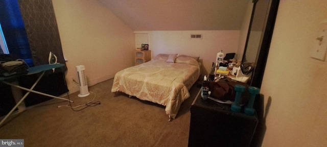 carpeted bedroom with vaulted ceiling