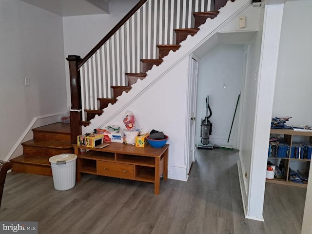 stairs with hardwood / wood-style flooring