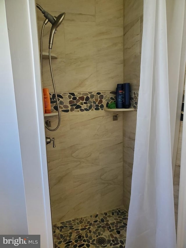 bathroom featuring walk in shower