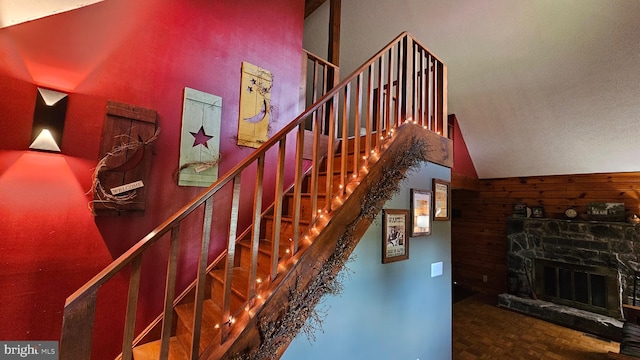 stairs featuring a fireplace