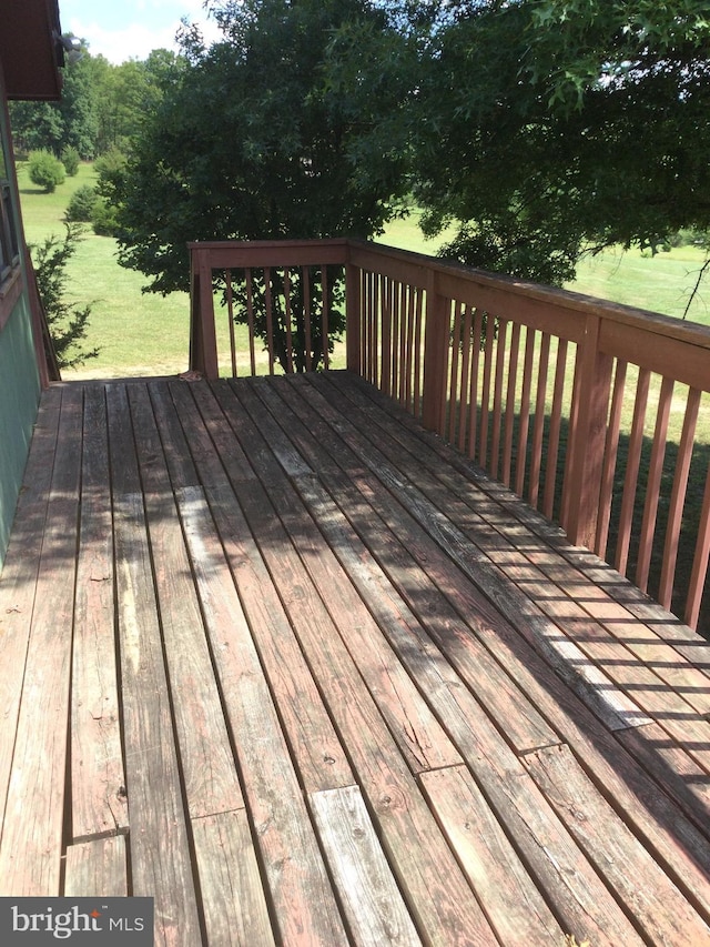 wooden terrace with a yard