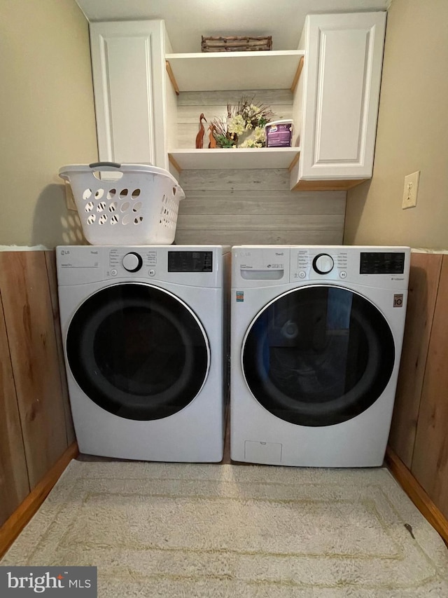 laundry area with cabinets and washer and dryer