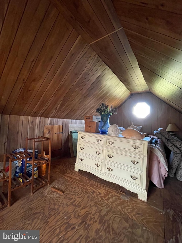 interior space with lofted ceiling and wood walls