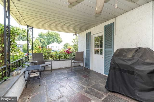 view of patio featuring area for grilling and ceiling fan