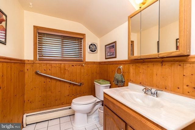 bathroom with vanity, tile patterned floors, vaulted ceiling, toilet, and a baseboard radiator