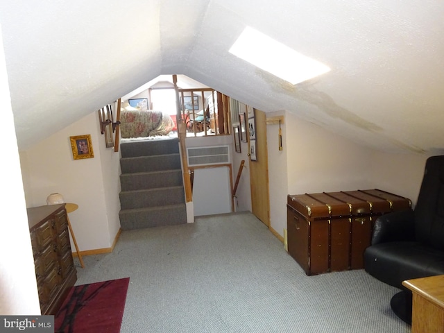 bonus room with light colored carpet and lofted ceiling