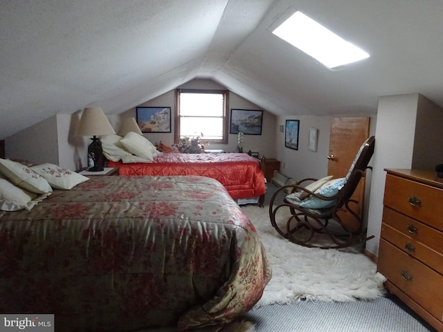 bedroom featuring carpet floors and vaulted ceiling