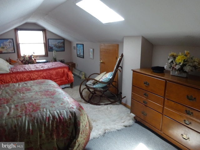 bedroom with light colored carpet and vaulted ceiling