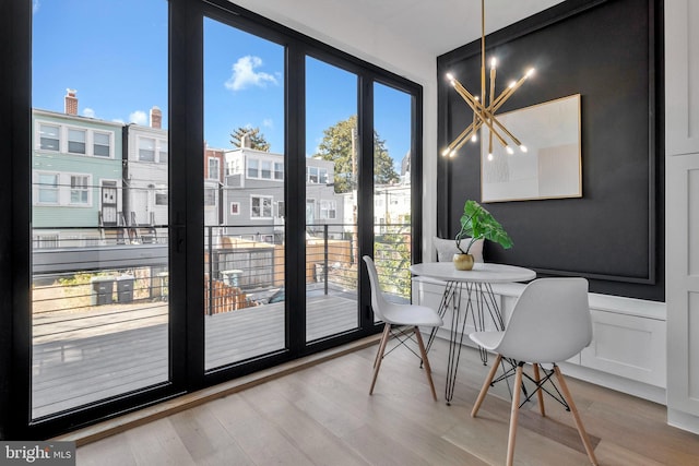 interior space with hardwood / wood-style floors and an inviting chandelier