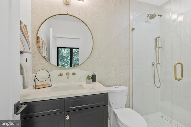 bathroom with vanity, toilet, and walk in shower