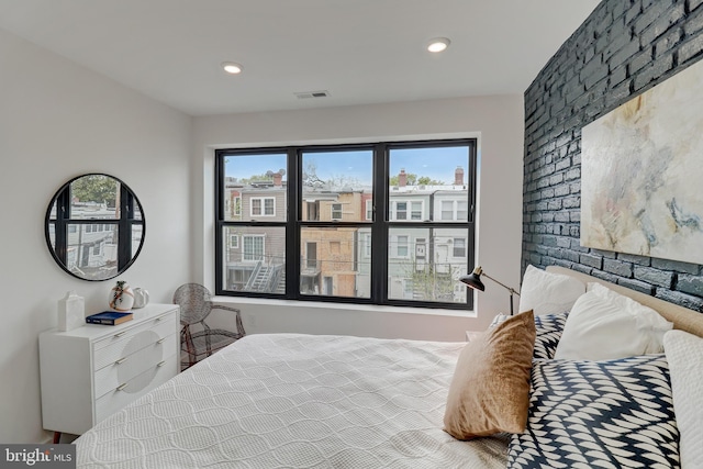 bedroom with multiple windows