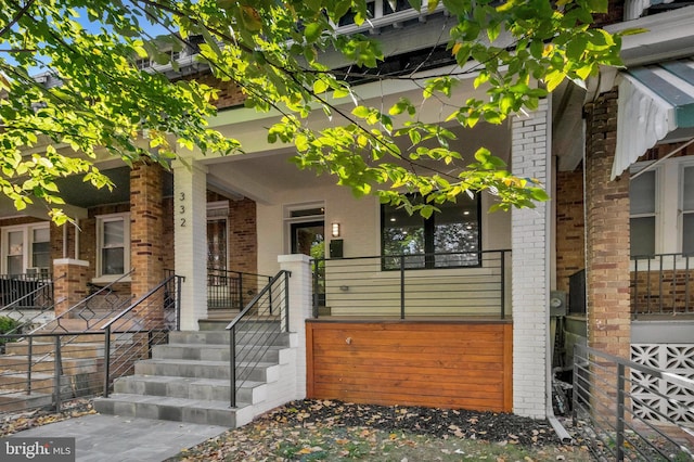 doorway to property with a porch