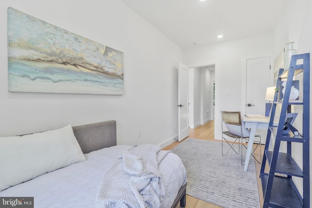 bedroom with hardwood / wood-style flooring