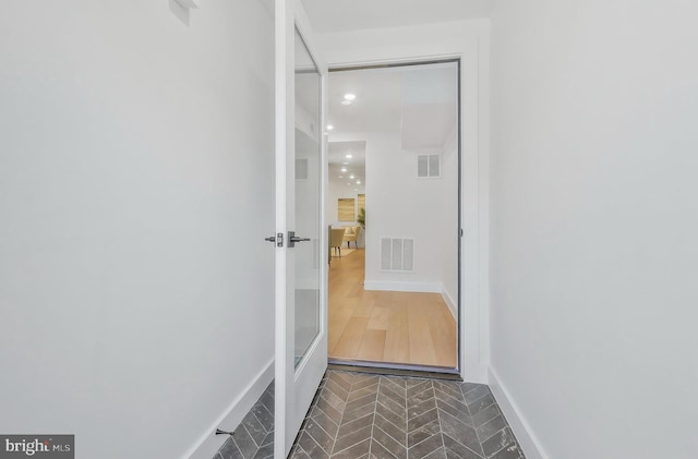 hall with dark hardwood / wood-style floors