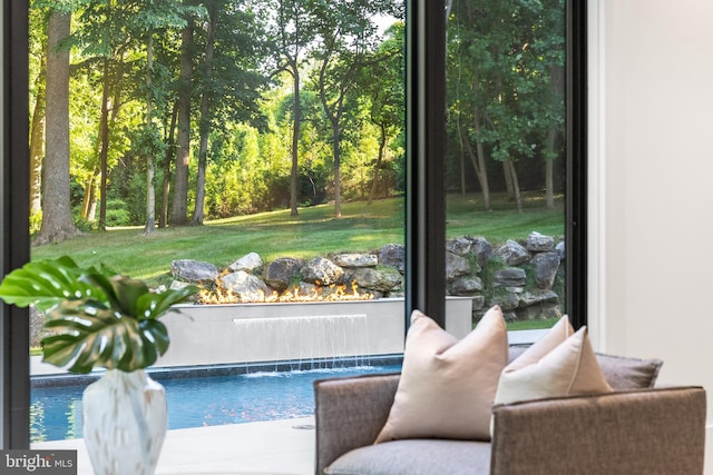 view of swimming pool featuring pool water feature