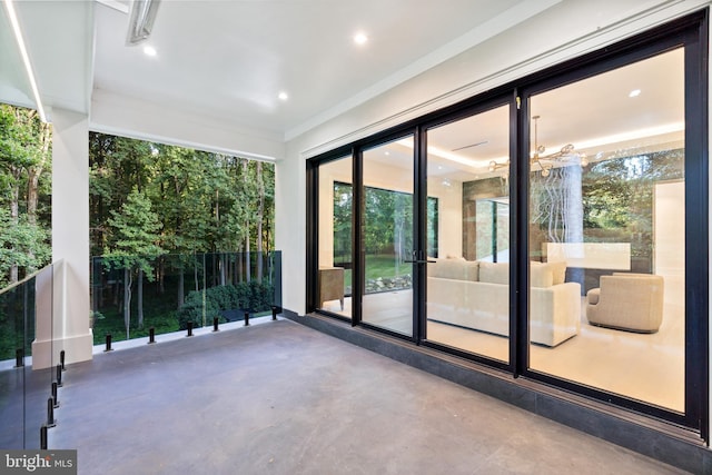 doorway to outside with concrete floors