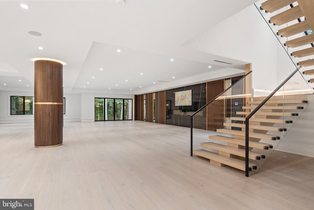 staircase featuring hardwood / wood-style floors