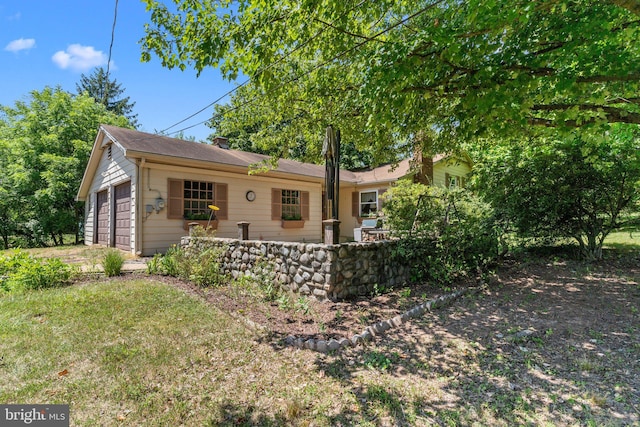 view of front of property with a garage