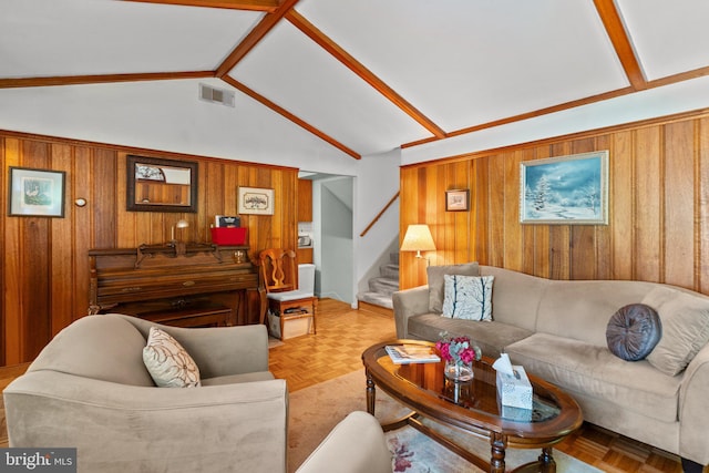 living room featuring light parquet flooring, vaulted ceiling, and wood walls