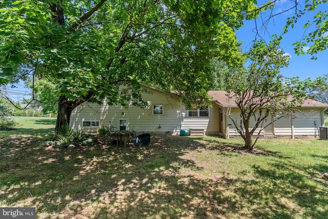 rear view of house featuring cooling unit