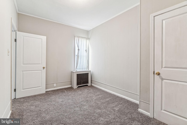 unfurnished bedroom with carpet and crown molding