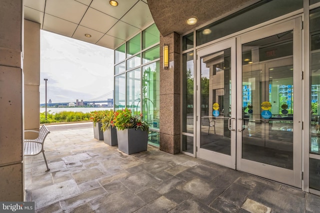 doorway to property featuring a patio area and french doors