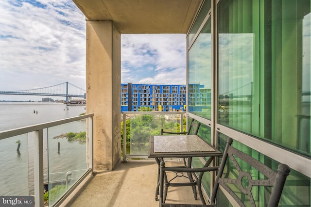 balcony featuring a water view