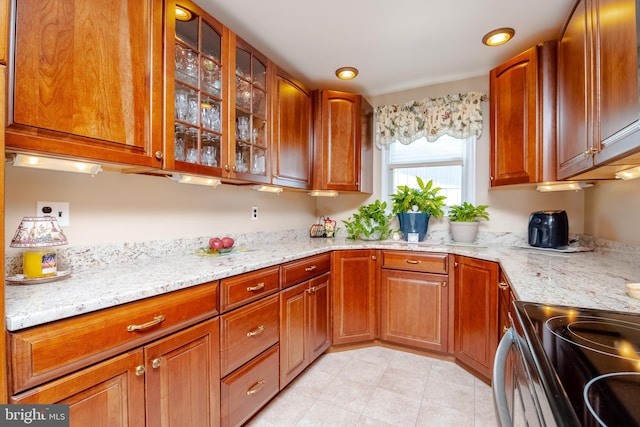 kitchen featuring light stone countertops