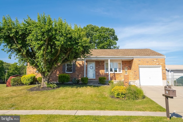 view of front of property with a front lawn and a garage