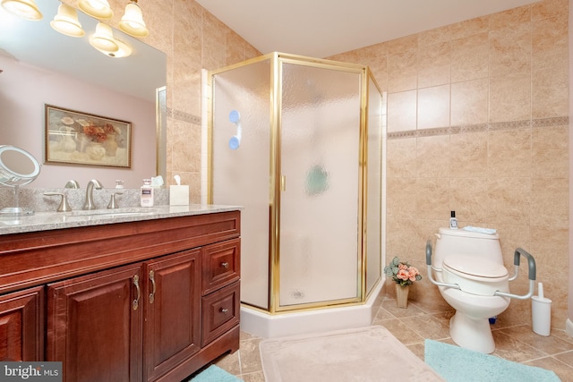 bathroom featuring walk in shower, tile patterned flooring, toilet, vanity, and tile walls