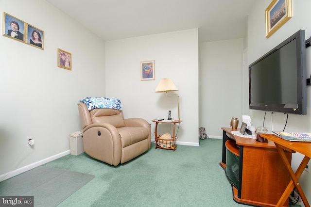 living area featuring carpet floors