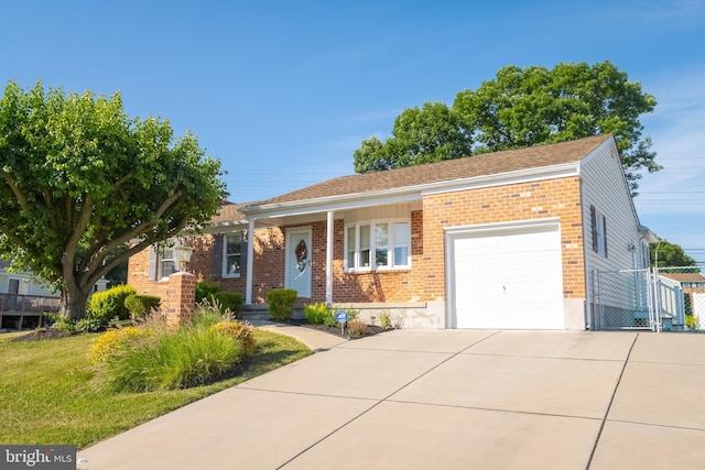 single story home featuring a garage and a front yard