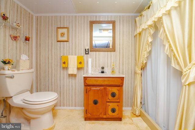 bathroom featuring tile patterned floors, crown molding, vanity, and toilet