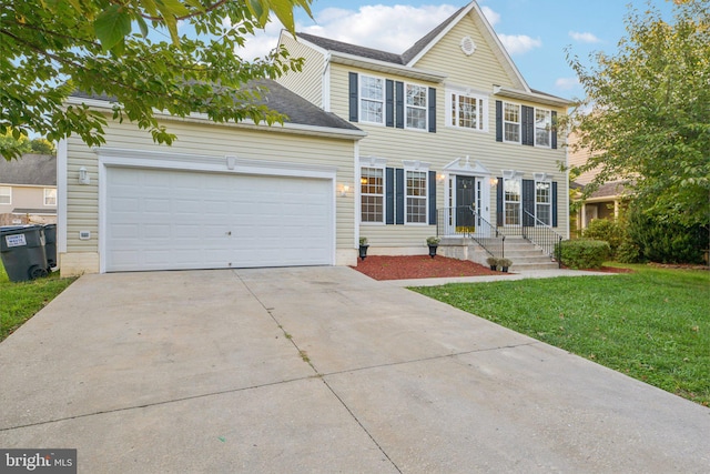 colonial house with a garage and a front lawn