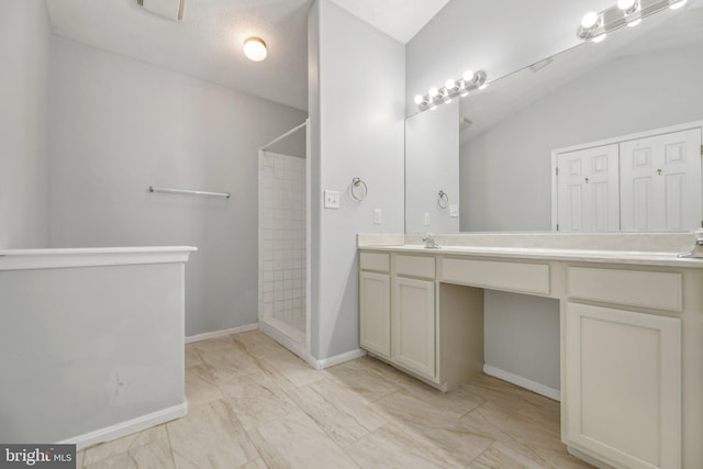 bathroom featuring vanity and walk in shower