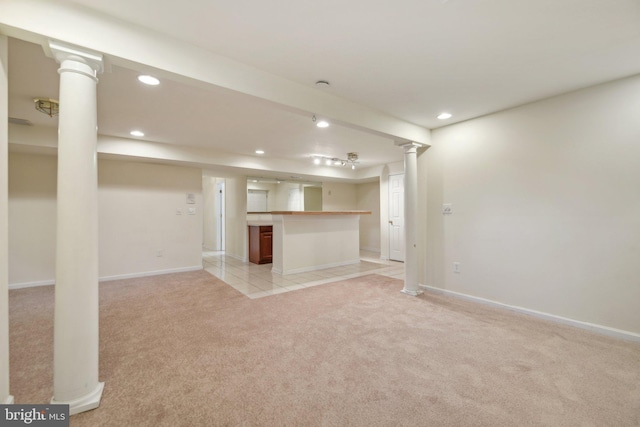 basement featuring light carpet