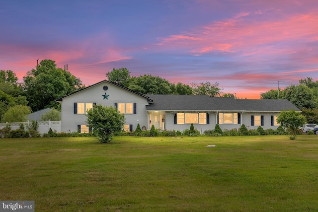 view of front of home featuring a yard