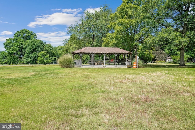 surrounding community featuring a gazebo and a lawn