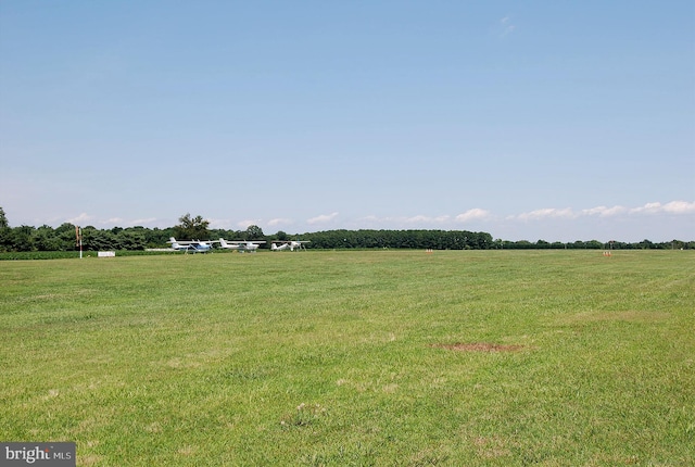 view of yard with a rural view