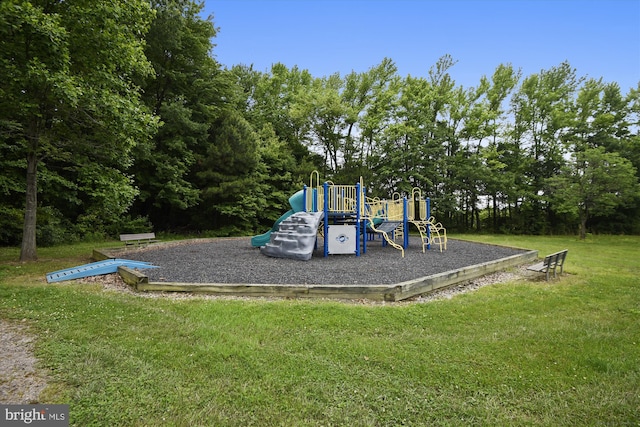 view of jungle gym with a lawn