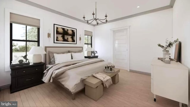 bedroom with a notable chandelier and light wood-type flooring