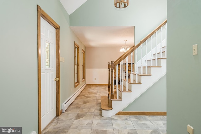 foyer featuring a chandelier, vaulted ceiling, and a baseboard radiator