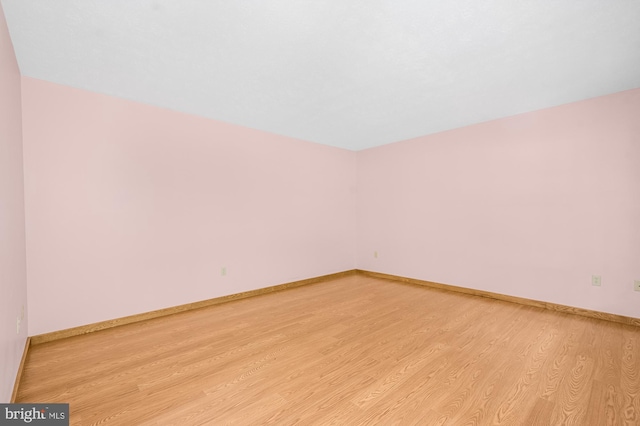 spare room featuring light hardwood / wood-style floors