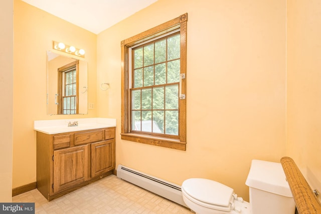 bathroom with vanity, a baseboard radiator, and toilet