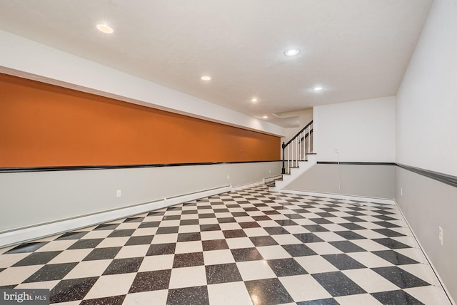 basement featuring a baseboard heating unit