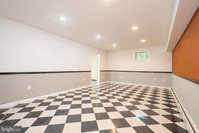 unfurnished room featuring a baseboard radiator